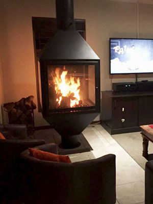 Square glass Freestanding fireplace with tapered base